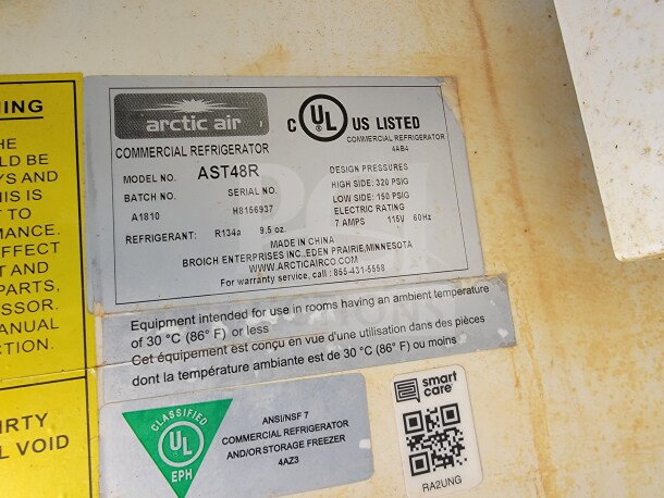 Arctic Air commercial refrigerator label showing model AST48R, batch A1810, serial H8156937, with specifications.
