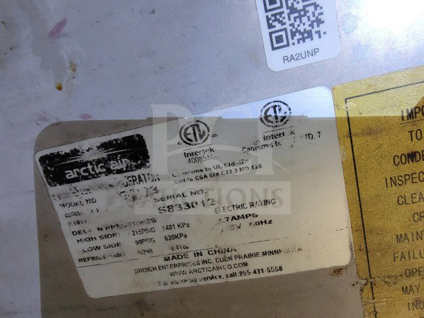 Label from Arctic Air equipment in Diamond Cargo 24 mobile kitchen trailer, showing model and serial numbers for identification.