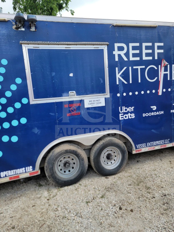 2019 Diamond Cargo 8.5' x 24' dual-axle mobile kitchen trailer, blue exterior, service window, "REEF KITCHEN" branding, visible wear.