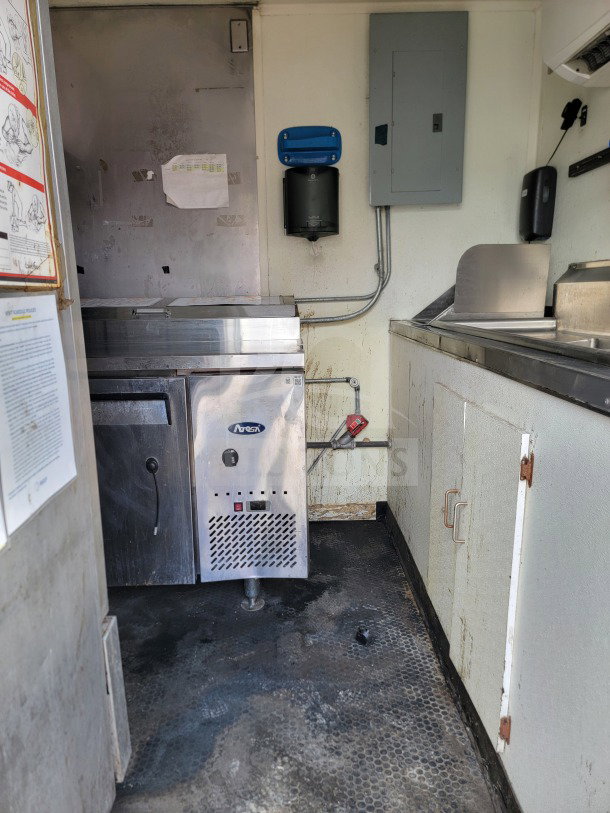 2019 Diamond Cargo 8.5' x 24' mobile kitchen interior with American Range fry line, Globe electric griddle, and utility setup.