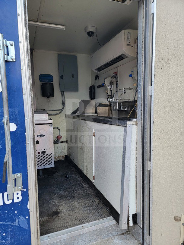 2019 Diamond Cargo 8.5' x 24' mobile kitchen trailer interior, showing stainless steel sink, counter, and equipment, in used condition.