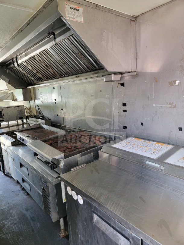 2019 Diamond Cargo 8.5' x 24' Mobile Kitchen Trailer interior with American Range fry line, Globe Electric griddle.