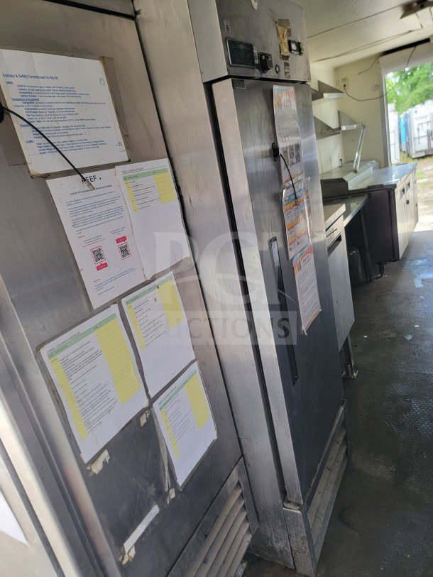 2019 Diamond Cargo 8.5' x 24' mobile kitchen trailer interior with equipment. Visible safety and procedure notices.