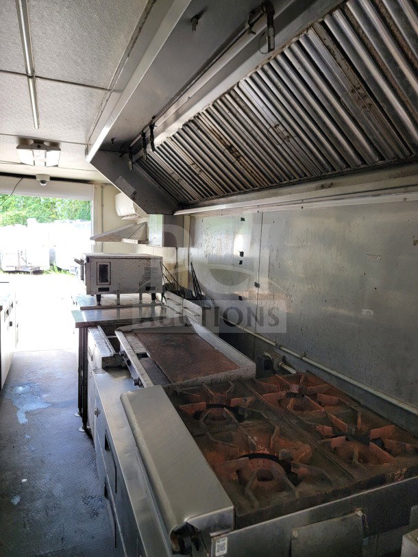 2019 Diamond Cargo 8.5' x 24' mobile kitchen trailer interior with American Range fry line, Globe electric griddle.