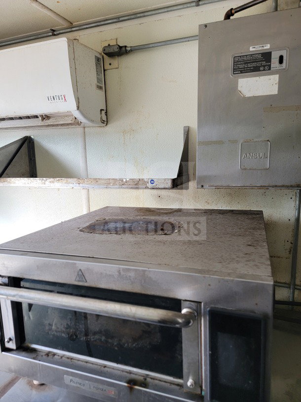 2019 Diamond Cargo mobile kitchen interior with American Range fry line and Globe Electric griddle. Dual-axle setup.
