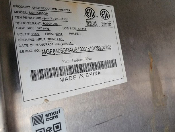 Label on Diamond Cargo trailer states undercounter freezer model MGF8405GR; temp: -8° to 1°F; manufactured 2018-10.
