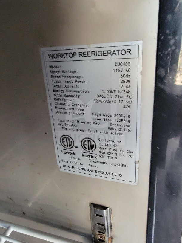 Label on Dukers Appliance Co. worktop refrigerator. Model: DUC48R, Voltage: 115V AC, Capacity: 346L, Made in China.