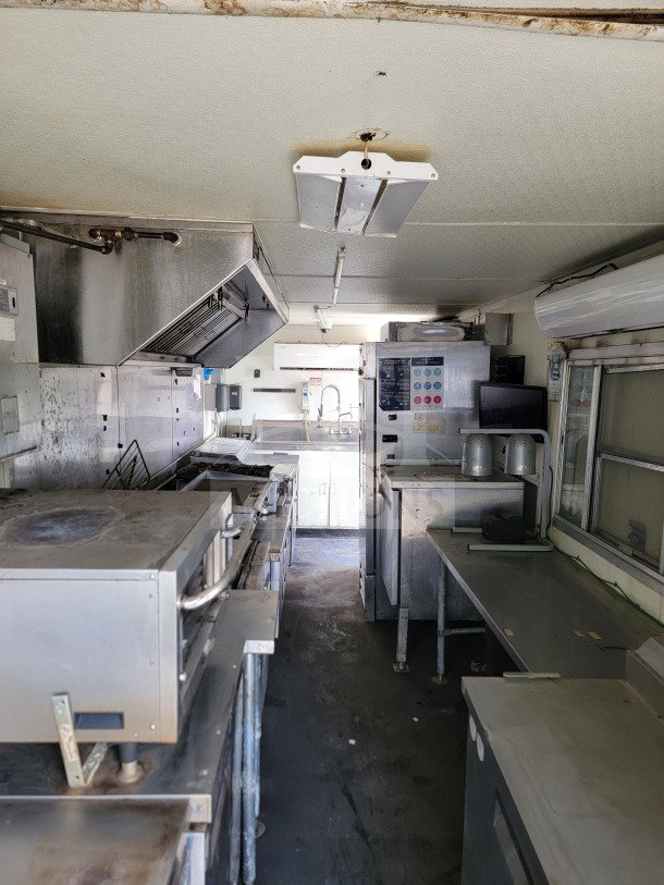 2019 Diamond Cargo 8.5' x 24' mobile kitchen trailer interior with American Range fry line, Globe Electric griddle.