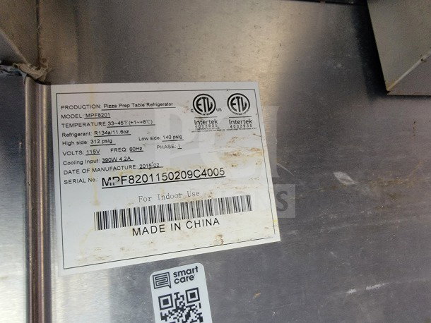 Label on stainless steel surface for Pizza Prep Table Refrigerator, Model MPF8201, made in China, manufactured 2015.