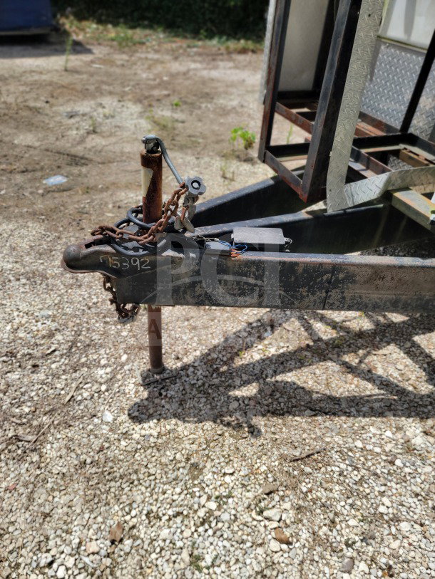 2019 Diamond Cargo 8.5' x 24' trailer hitch with visible chains, handle, and ID marking 15392.