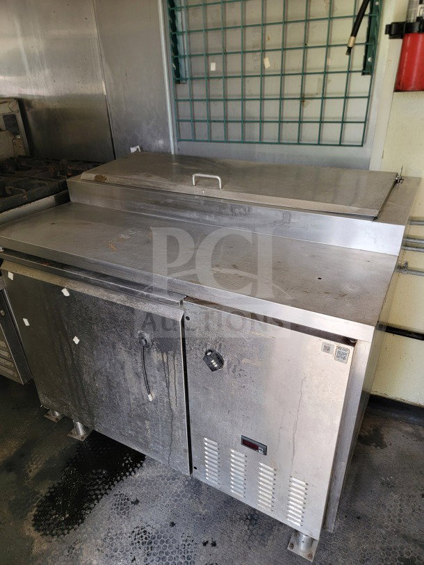 2019 Diamond Cargo 24' mobile kitchen trailer interior with Serv-Ware refrigeration unit, showing signs of wear and use.