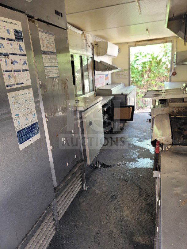 2019 Diamond Cargo 8.5' x 24' mobile kitchen trailer interior, featuring commercial-grade stainless appliances and Serv-Ware lineup.