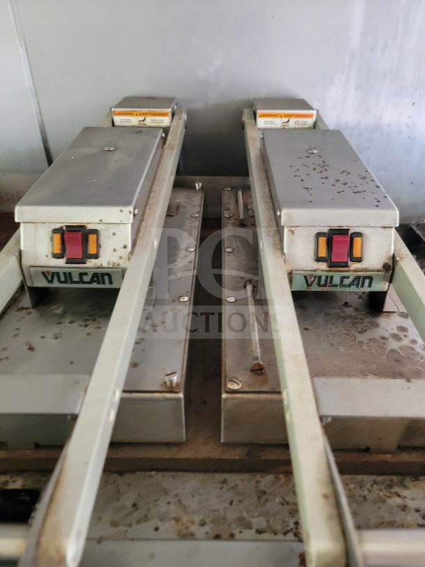 Dual Vulcan commercial kitchen appliances showing rust and wear, suitable for mobile kitchen trailer setup.