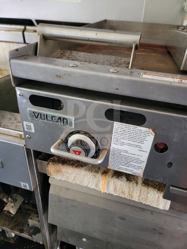 Vulcan commercial kitchen appliance control panel on a 2019 Diamond Cargo mobile kitchen trailer, showing dials and usage instructions.