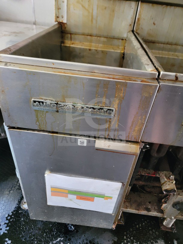 Commercial kitchen fryer from American Range, visible rust and residue. Includes QR code and document with color chart.