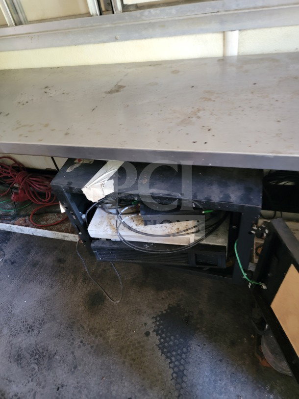 2019 Diamond Cargo mobile kitchen trailer interior showing workbench, cables, and storage area in used condition.
