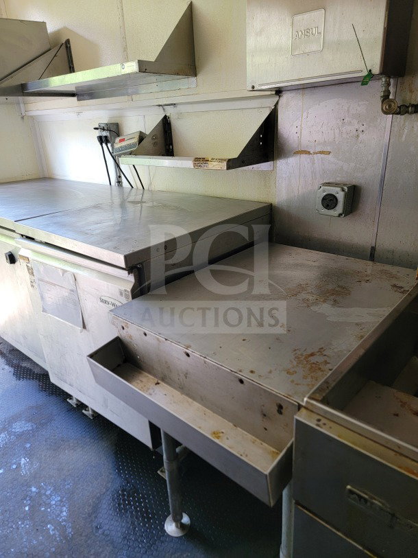 2019 Diamond Cargo mobile kitchen trailer interior, featuring Serv-Ware refrigeration units and stainless steel counters.