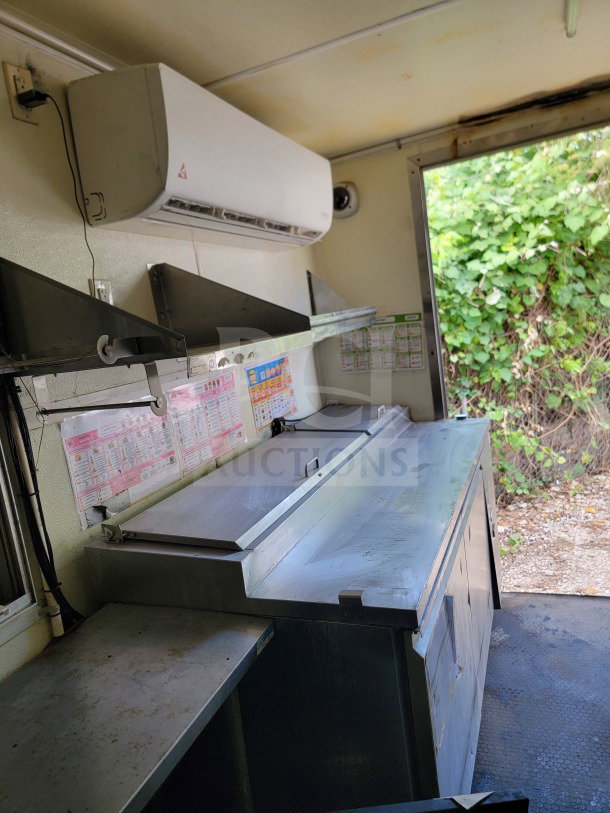2019 Diamond Cargo mobile kitchen trailer interior with Serv-Ware refrigeration, menu displays, and ample prep space.