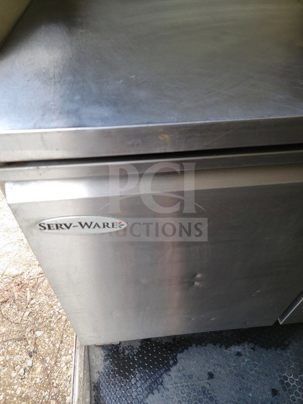 Serv-Ware refrigeration unit inside a 2019 Diamond Cargo 8.5' x 24' mobile commercial kitchen trailer.