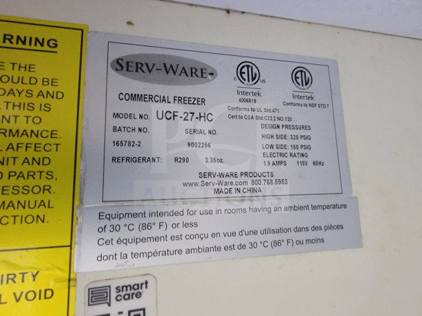 Serv-Ware commercial freezer label, model UCF-27-HC, serial 9002256. Specs: R290 refrigerant, 115V, 1.9 amps.