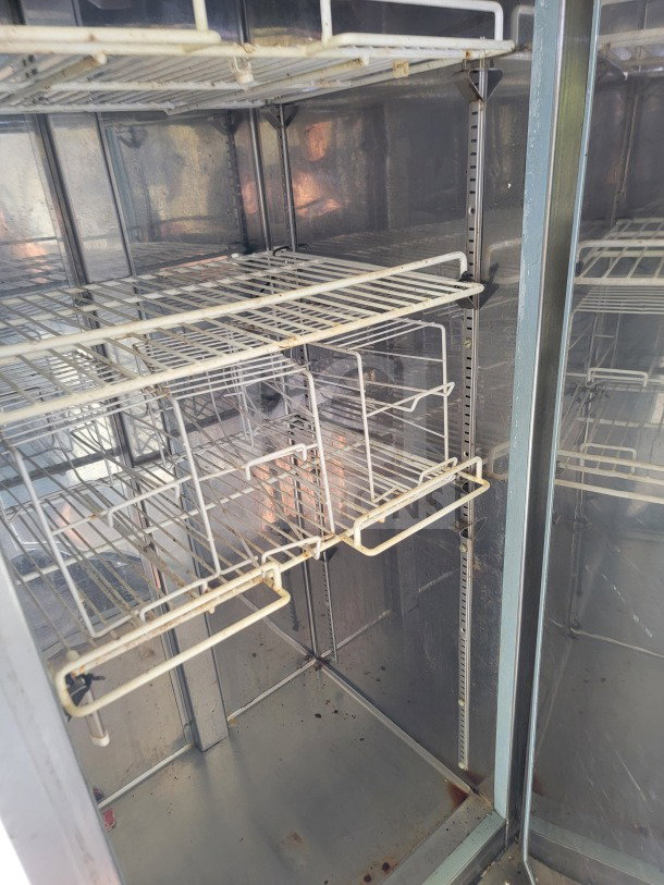 Interior view of a supplemental refrigeration unit with wire shelving, part of a 2019 Diamond Cargo commercial kitchen trailer.