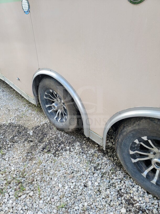 2021 Forest River 8.5' x 24' mobile kitchen trailer, dual-axle wheels, exterior view, in good condition.