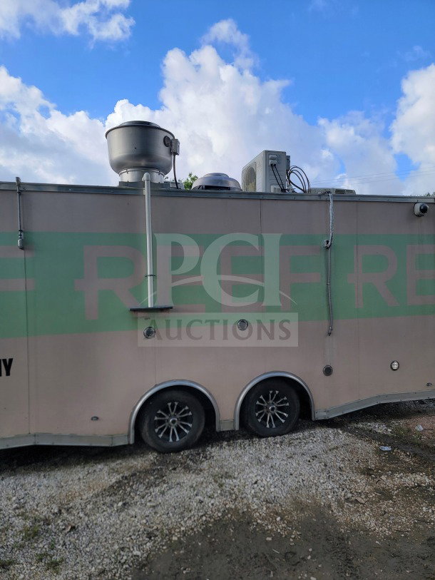 2021 Forest River 8.5' x 24' mobile kitchen trailer, tandem-axle, oven venting and refrigeration units visible, side view.