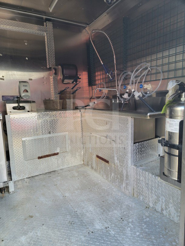 2021 Forest River mobile kitchen trailer, stainless interior, Royal Range suite, Arctic Air refrigeration, VIN visible.