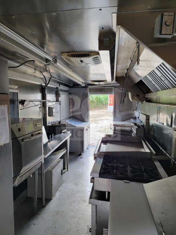 2021 Forest River 8.5' x 24' mobile kitchen trailer interior; featuring Royal Range cooking suite and Arctic Air refrigeration.