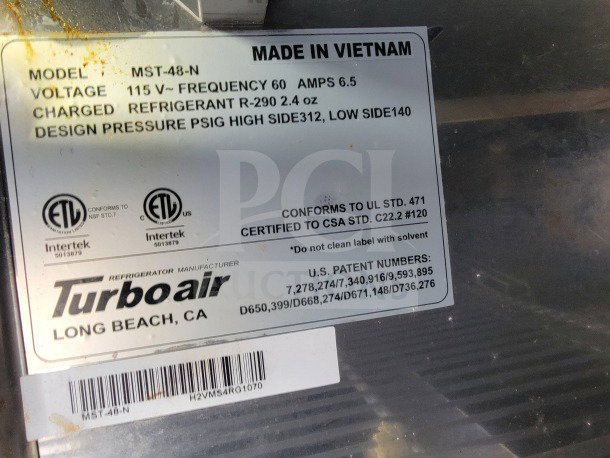 Label on Turbo Air refrigerator in Forest River mobile kitchen trailer, showing model MST-48-N, voltage 115V, frequency 60Hz.