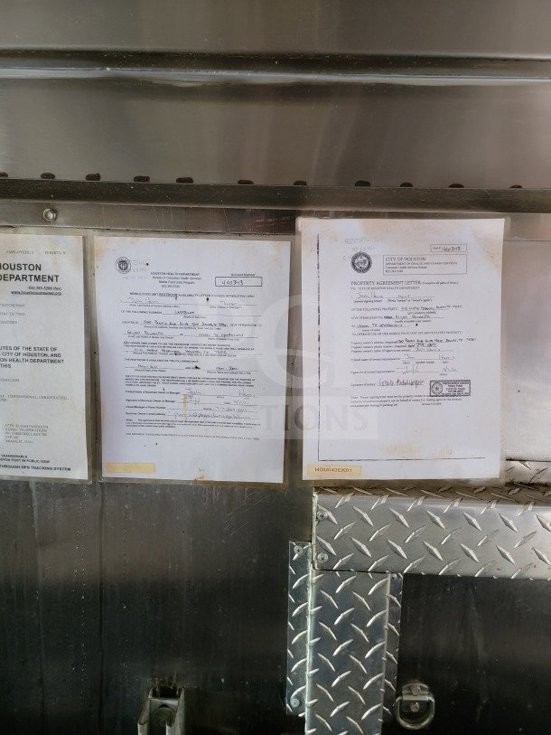 2021 Forest River 8.5' x 24' mobile kitchen trailer interior showing health department permits and agreement letters.