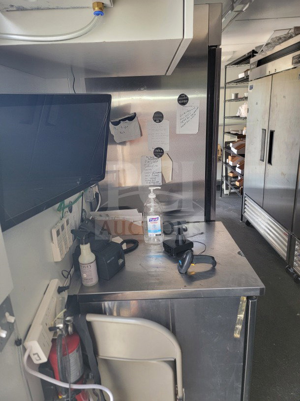 Interior of 2021 SDG 8.5' x 26' trailer, logistics configuration with Turbo Air and Blueair refrigeration. Multiple notes, sanitizer, headset, and fire extinguisher visible.
