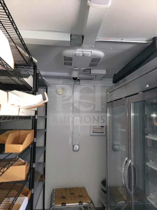 2021 SDG 8.5' x 26' trailer interior with Turbo Air & Blueair refrigeration. Shelves, cooling unit, and durable metal finish.