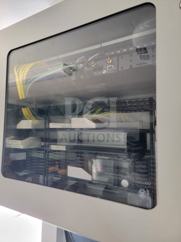 Inside view of SDG 8.5'x26' trailer highlighting shelving, networking equipment, and cabling in logistics configuration.