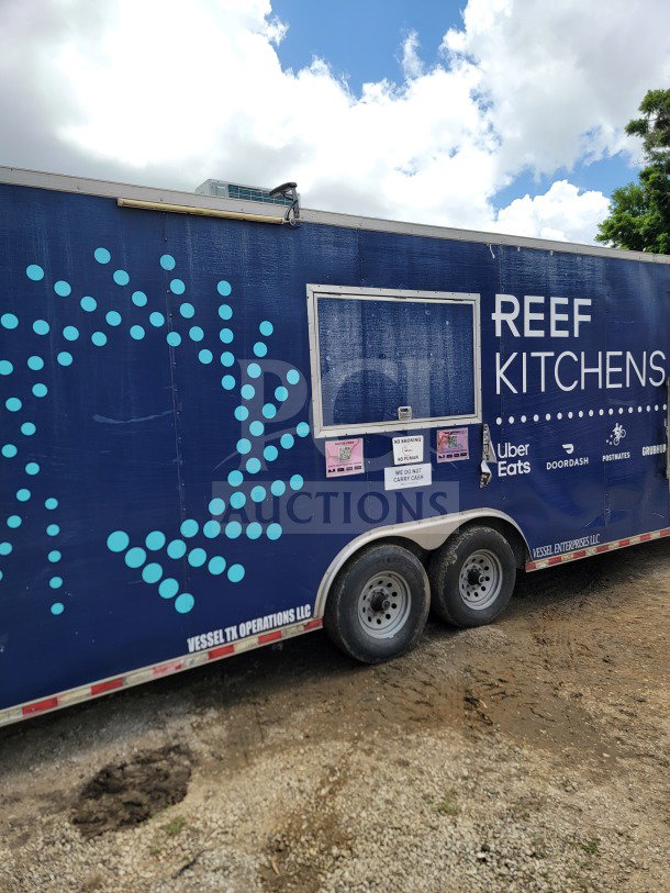 2019 Diamond Cargo 8.5' x 24' mobile kitchen trailer with dual axles. Features REEF Kitchens branding.