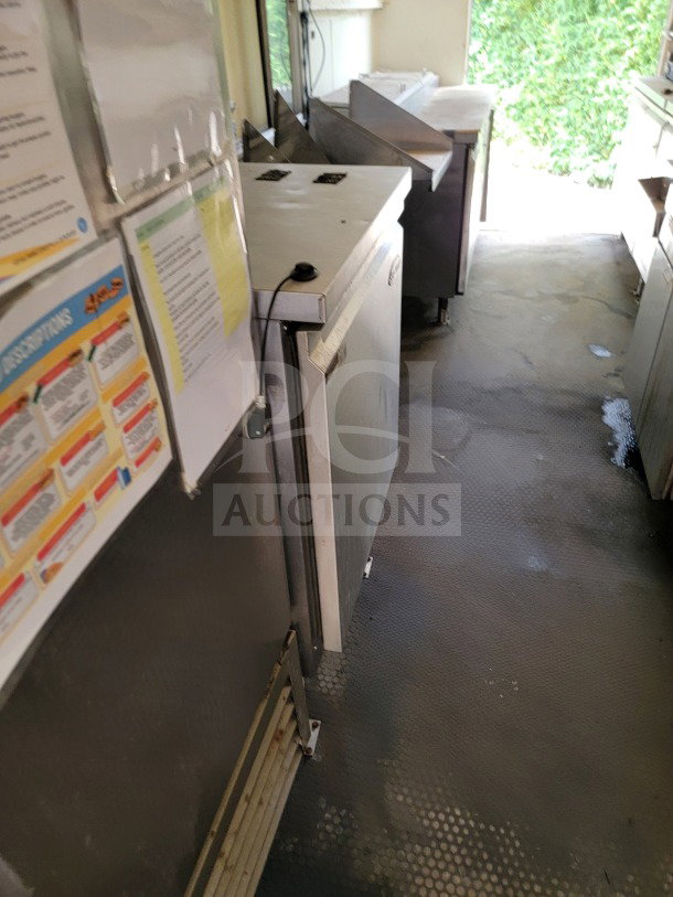 2019 Diamond Cargo mobile kitchen trailer interior, featuring American Range cooking suite, Serv-Ware refrigeration, in good condition.