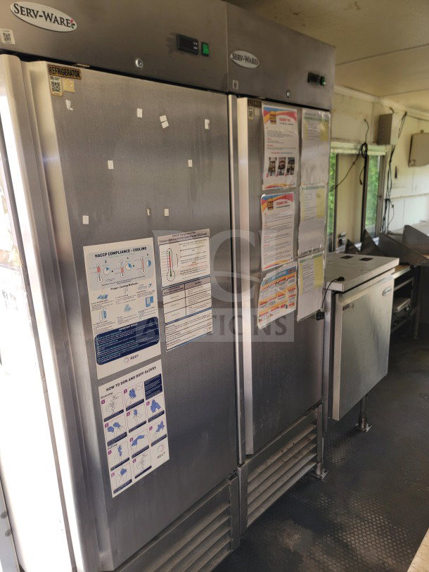 Serv-Ware refrigeration unit in Diamond Cargo mobile kitchen trailer. Features HACCP compliance charts and storage guidelines.