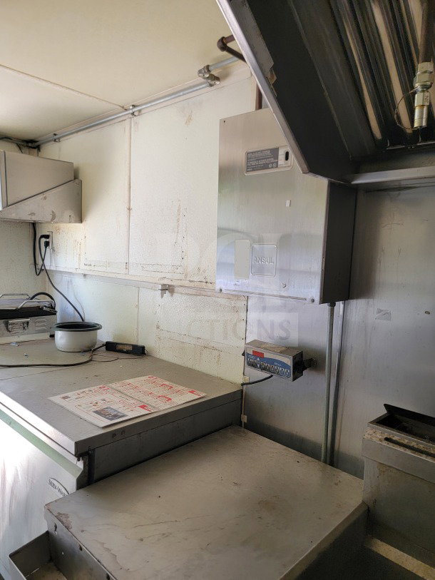 2019 Diamond Cargo 8.5' x 24' mobile kitchen interior, featuring American Range cooking suite, Serv-Ware refrigeration.