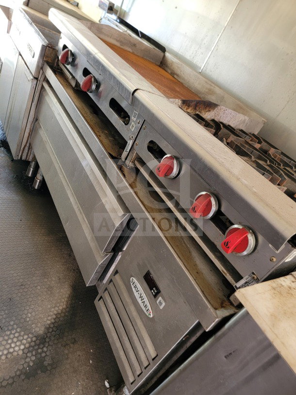 2019 Diamond Cargo Mobile Kitchen Trailer interior with American Range cooking suite and Serv-Ware refrigeration.