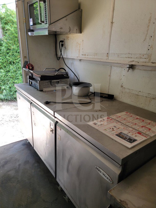 2019 Diamond Cargo mobile kitchen trailer interior with American Range suite, Serv-Ware refrigeration, visible wear.