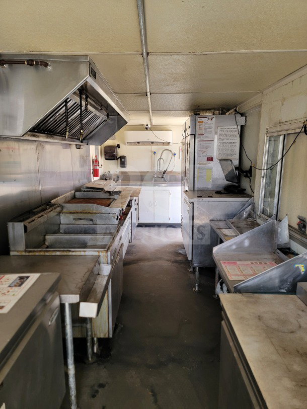2019 Diamond Cargo 8.5' x 24' mobile kitchen trailer interior, featuring American Range cooking suite and Serv-Ware refrigeration.