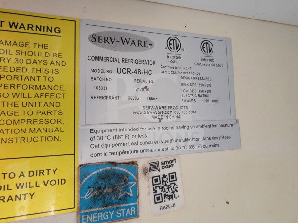 Commercial refrigerator label from Serv-Ware, model UCR-48-HC, with specifications and ETL certifications shown.