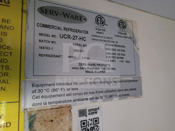 Label on Serv-Ware commercial refrigerator, model UCR-27-HC, indicating refrigerant R600a, 115V, made in China.