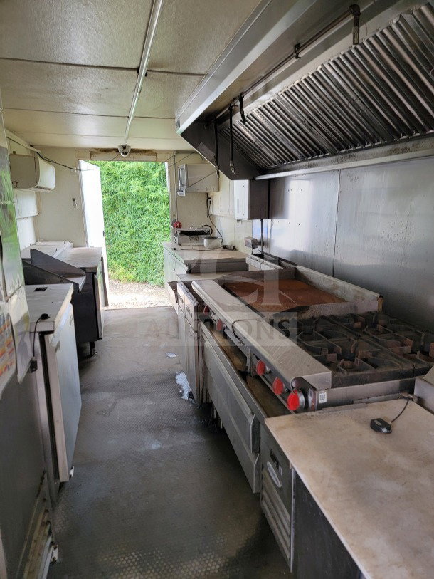 2019 Diamond Cargo mobile kitchen trailer interior with American Range cooking suite and Serv-Ware refrigeration.