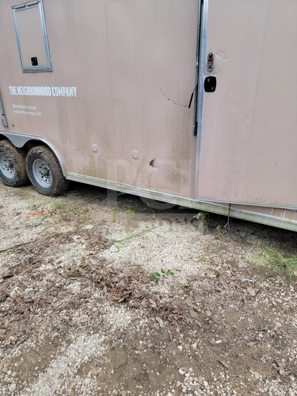 2021 BT&S 8.5' x 24' mobile kitchen trailer, tandem-axle, visible dents, external labels, corporate delivery configuration.
