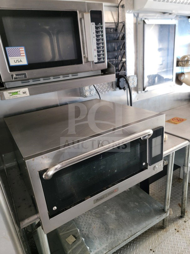 2021 BT&S 8.5' x 24' Mobile Kitchen Trailer interior, featuring stainless steel equipment and U.S. and NSF labels.