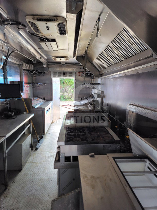Interior of 2021 BT&S 8.5' x 24' mobile kitchen trailer, equipped with HVAC Mirage VentusX. Tandem-axle, stainless steel fixtures.