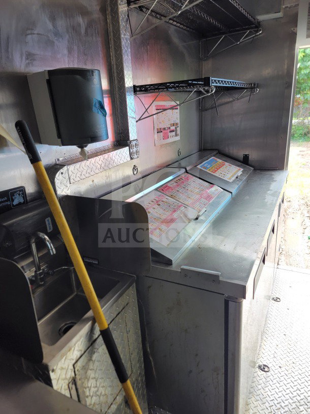 2021 BT&S 8.5' x 24' mobile kitchen trailer interior, featuring stainless steel counters, sink, shelving, and HVAC VentusX.