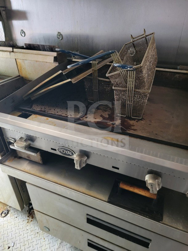 Royal commercial grill and fryer in used condition, inside a 2021 BT&S 8.5' x 24' mobile kitchen trailer.