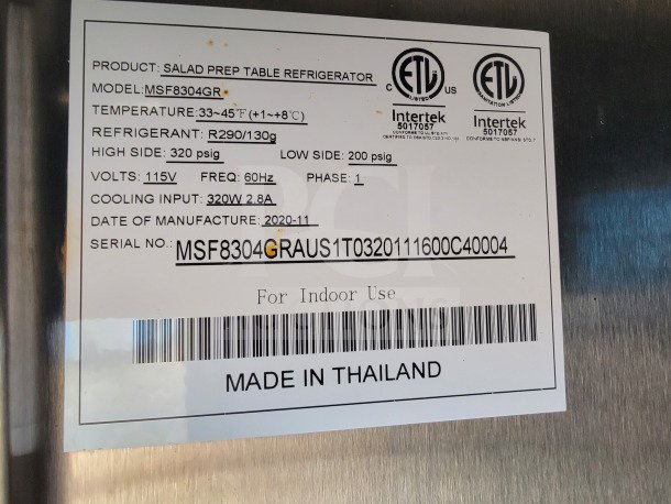 Salad prep table refrigerator label detailing model MSF8304GR, temp range 33-45°F, refrigerant R290, voltage 115V, made in Thailand.